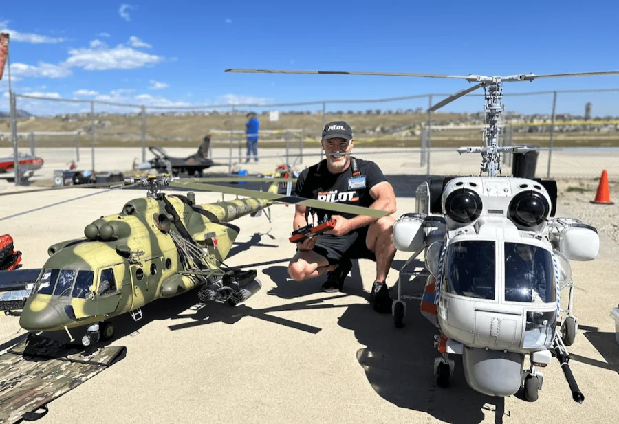 A pilot with scale radio control helicopters